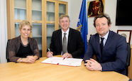 IARC agreement document being signed by three parties thumbnail