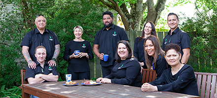 Maori Centre Staff having a cup of tea outside at the picnic table image