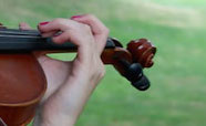 Violin on the university grounds by clocktower