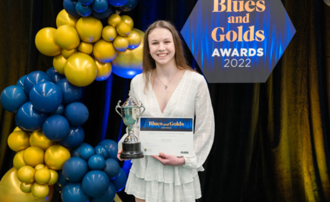 Brooke Davies with her trophy and certificate image