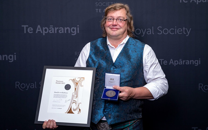 David Hutchinson with his 2022 Thomson Medal and certificate image