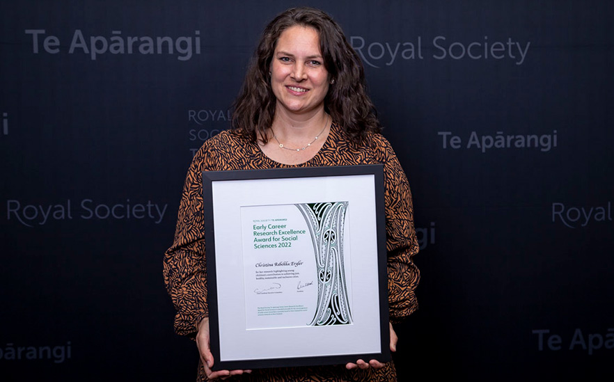 Christina Ergler with her 2022 Early Career Research Excellence Award certificate image