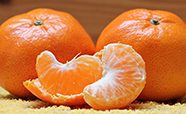 Two tangerines and tangerine segments image