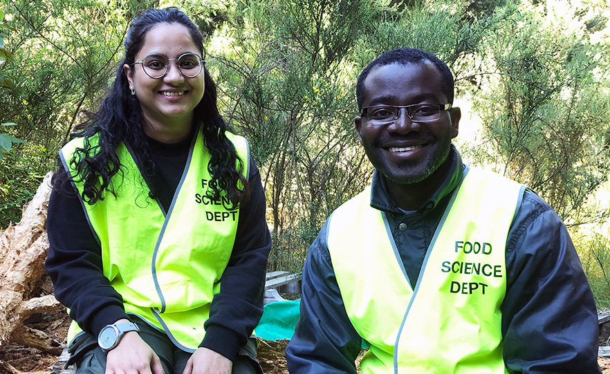 Ruchita Kavle and Dominic Agyei on a field expedition in a forest image