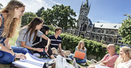 University of Otago student discussion on the Clocktower Lawn. Image.