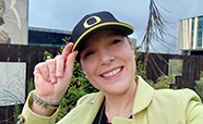 Dr Gabriella Lindberg tipping her University of Oregon cap thumbnail
