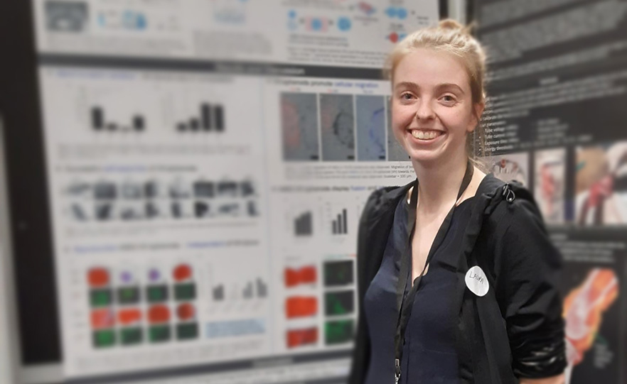 Laura Veenendaal in front of her winning poster image