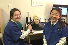 Students from Rangi Ruru Girls High School GATE programme practising eye examination using a part-task trainer at the Simulation Centre