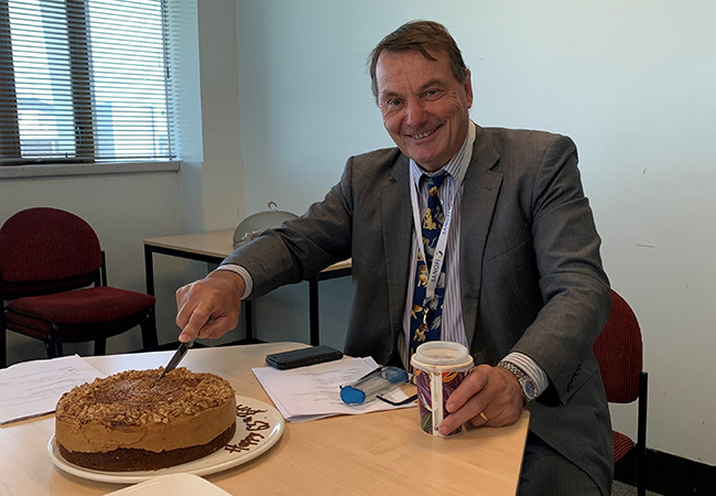Professor Gary Hooper with his surprise birthday cake image