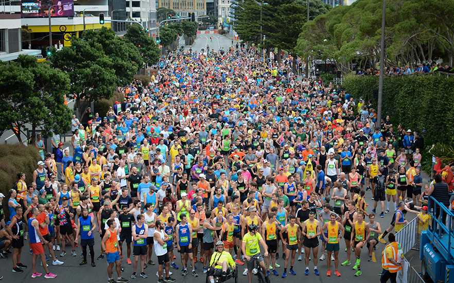 Runners lining up at the start line for around the bays race image