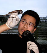 Dr Shinichi Nakagawa holding bird