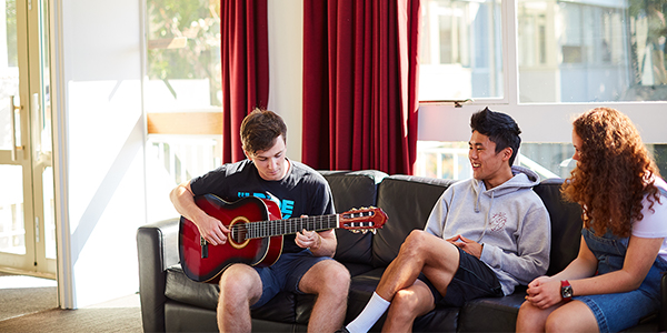Students playing guitar in Carrington College