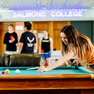 Students playing pool inside of Salmond College