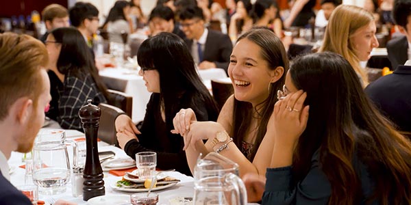 Students dining formally inside St Margaret's College