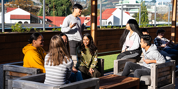 Students talking in the outdoor area of Toroa College