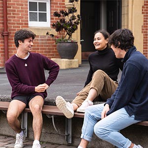 Selwyn students talking in the outdoor common area