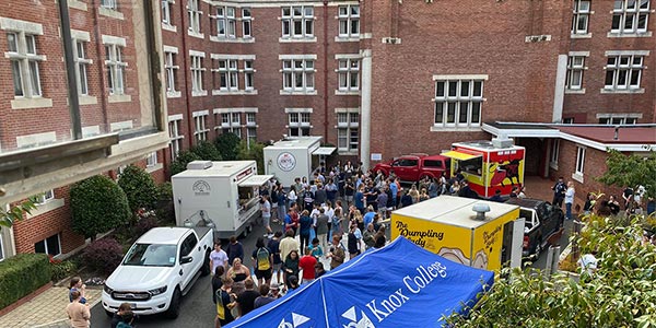 Knox students in outdoor area with food trucks