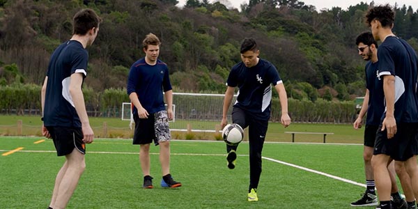 St Margaret's College students playing soccer