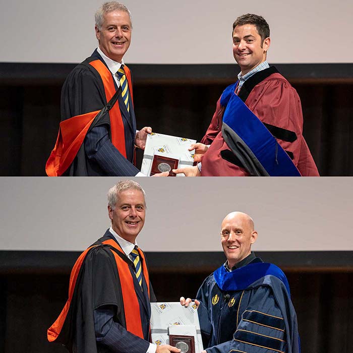 Two University staff being presented with awards