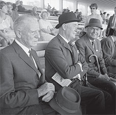 The Governor-General, Sir Arthur Porritt (centre) at the first day of the Wairarapa Racing Club’s summer meeting, 30 December 1967. He is pictured with the president of the club, James Donald, and a steward, Mr EA Riddiford. (Dominion Post collection, Alexander Turnbull Library, Ref: EP/1968/0016-F)